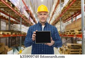 happy businessman with tablet pc at warehouse happy businessman with tablet pc at warehouse