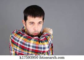 Man coughing in elbow