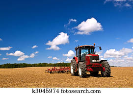 Tractor in plowed field Tractor in plowed field