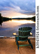 Wooden chair at sunset on beach