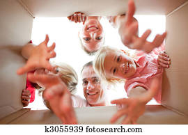 Jolly family unpacking boxes 