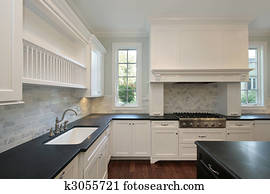 Kitchen with black countertops