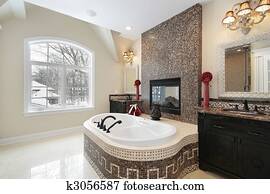 Master bath with marble tile tub