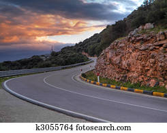 Mountain road at sunset. 