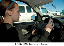 Teen girl texting while driving
