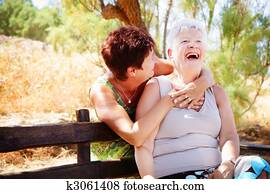 Beautiful senior mother and daughter having fun