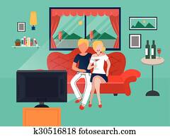 couple watching TV in the living room
