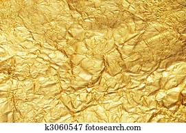 Crumpled gold foil textured background