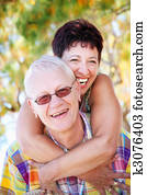 Mature couple smiling and embracing