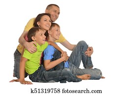 Smiling family sitting together