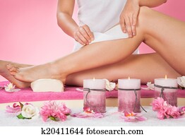 Therapist Waxing Customer's Leg At Spa Therapist Waxing Customer's Leg At Spa