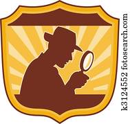 male detective inspector with magnifying glass set inside a shield male detective inspector with magnifying glass set inside a shield