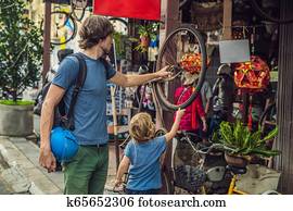 Dad and son in the background of Old houses in the Old Town of Georgetown, Penang, Malaysia