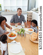 Loving family dining together