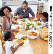Smiling family dining together Smiling family dining together