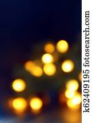Background of blurry yellow-orange lights of Christmas tree garland on dark. Copy space Background of blurry yellow-orange lights of Christmas tree garland on dark. Copy space