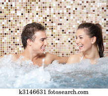 Happy couple in a jacuzzi