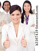 Attractive businesswoman and her team with thumbs up 