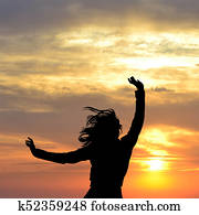 Happy for life concept with silhouette of woman enjoying sun