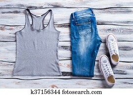 Gray tank top and jeans.
