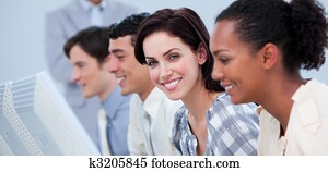 Positive business people working at a computer