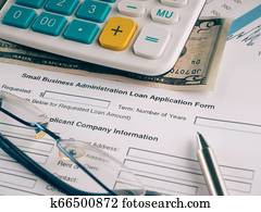 small business loan application on the desk.