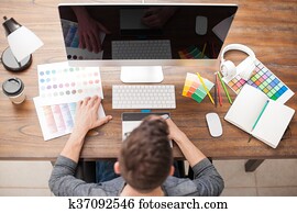 Top view of a graphic designer at work Top view of a graphic designer at work