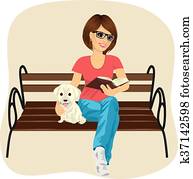 Young happy woman enjoying freetime outside reading book sitting on a bench hugging labrador puppy Young happy woman enjoying freetime outside reading book sitting on a bench hugging labrador puppy