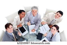 Successful international business people sitting in a meeting room Successful international business people sitting in a meeting room