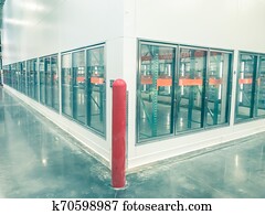 Vintage tone row of empty commercial fridges at wholesale big-box store Vintage tone row of empty commercial fridges at wholesale big-box store