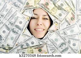 woman looking trought hole on money bacground