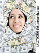 woman looking trought hole on money bacground