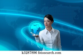 Attractive brunette holding virtual globe Attractive brunette holding virtual globe