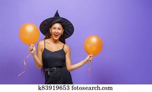 Young woman in black witch costume Young woman in black witch costume