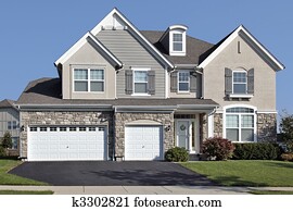 Home with three car stone garage