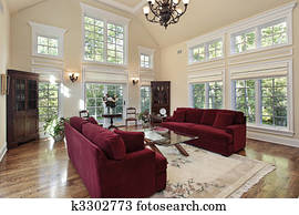 Living room with two story windows Living room with two story windows