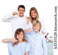 Merry family brushing their teeth