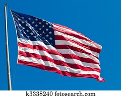 American Flag Waving Proudly on a Clear Windy Day American Flag Waving Proudly on a Clear Windy Day