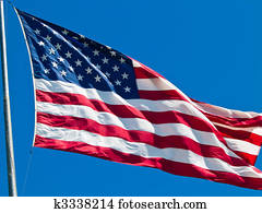 American Flag Waving Proudly on a Clear Windy Day American Flag Waving Proudly on a Clear Windy Day