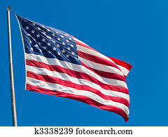 American Flag Waving Proudly on a Clear Windy Day American Flag Waving Proudly on a Clear Windy Day