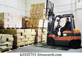 Forklift loader in warehouse