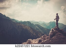 Woman hiker on a top of a mountain Woman hiker on a top of a mountain
