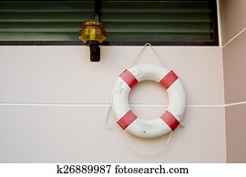 life vest on white wall.
