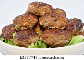 rissole with organic salad on a plate