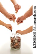 Hands of different generations saving coins