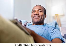 Joyful handsome man enjoying his free time