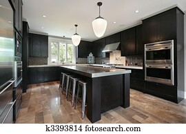 Kitchen with dark wood cabinetry Kitchen with dark wood cabinetry