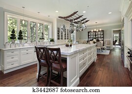 Kitchen with white granite island Kitchen with white granite island