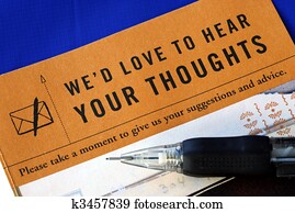 Customer fills in the feedback survey isolated on blue Customer fills in the feedback survey isolated on blue