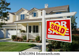 Sold Real Estate Sign and House